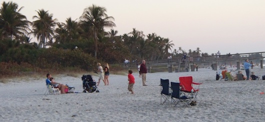 Families hanging out at the beach by the Pier in Naples Florida