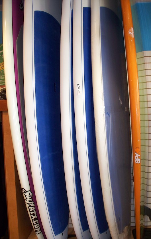Surf boards and Paddleboards and Kiteboards at Olde Naples Surf Shop